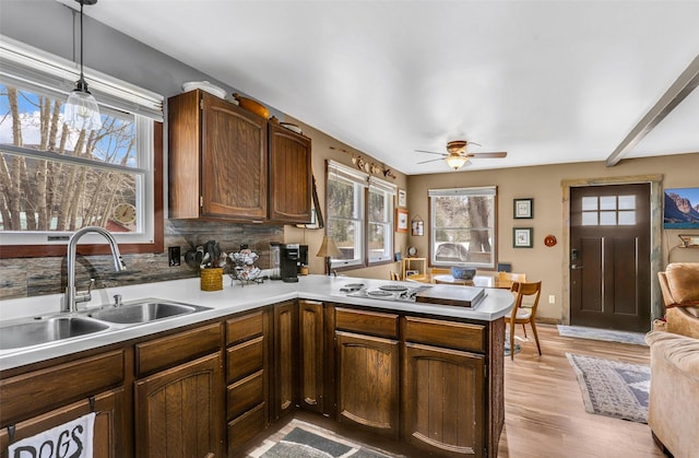 17 S Main St, Neihart, MT 59465 - kitchen with light countertops, ceiling fan, a peninsula, and a sink