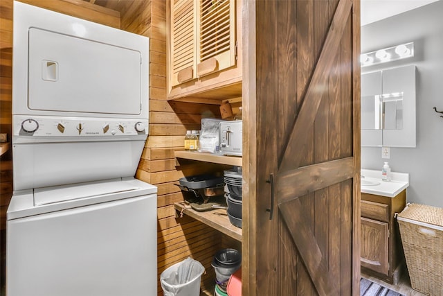 17 S Main St, Neihart, MT 59465 - washroom featuring wood walls and stacked washer and dryer