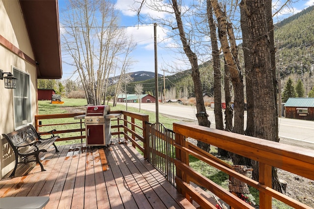 17 S Main St, Neihart, MT 59465 - wooden deck featuring a mountain view and a grill