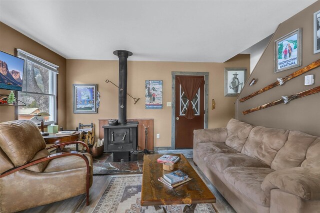 17 S Main St, Neihart, MT 59465 - living room featuring a wood stove and wood finished floors