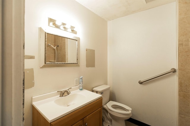 full bathroom featuring toilet, visible vents, a shower, and vanity