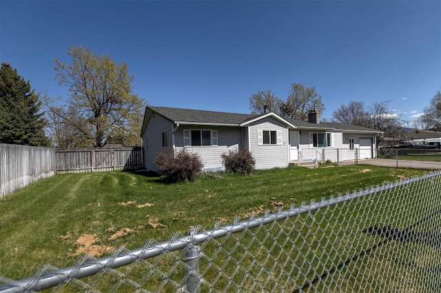 ranch-style house featuring a front lawn, a fenced backyard, a chimney, an attached garage, and driveway