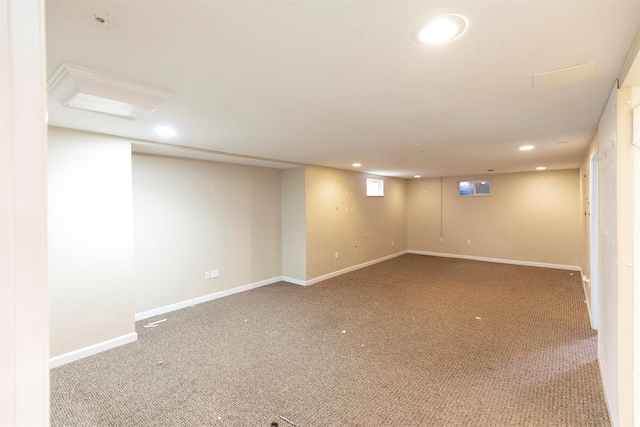 finished below grade area with carpet floors, baseboards, and recessed lighting