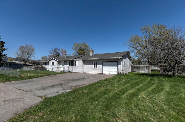 ranch-style house with fence, an attached garage, a front lawn, a chimney, and driveway