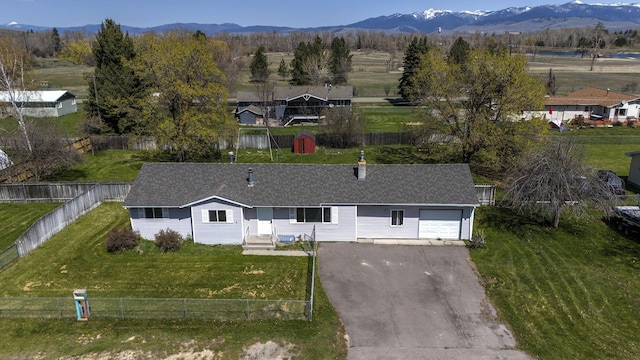 birds eye view of property featuring a mountain view
