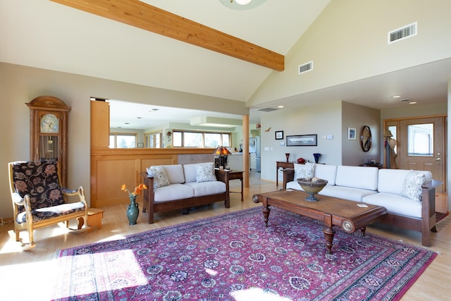 34051 Ridge Rd, Polson, MT 59860 - living area featuring light wood-style floors, high vaulted ceiling, beamed ceiling, and visible vents