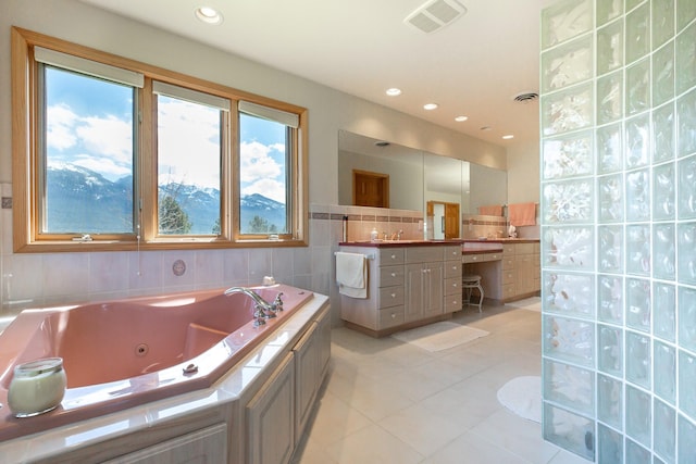 34051 Ridge Rd, Polson, MT 59860 - full bath featuring vanity, visible vents, tile patterned flooring, and a jetted tub