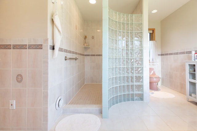 34051 Ridge Rd, Polson, MT 59860 - bathroom with tile walls, a walk in shower, tile patterned floors, toilet, and recessed lighting