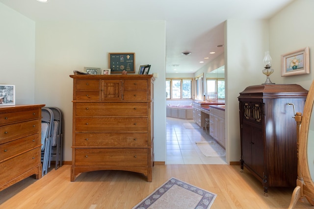 34051 Ridge Rd, Polson, MT 59860 - bedroom with light wood-type flooring, recessed lighting, and connected bathroom
