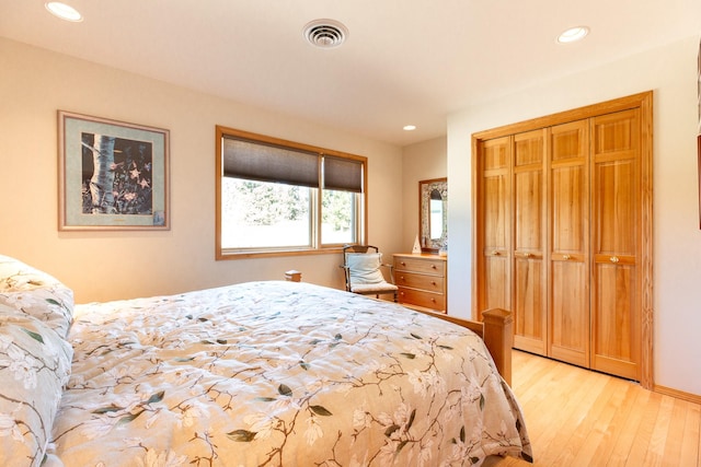 34051 Ridge Rd, Polson, MT 59860 - bedroom with recessed lighting, visible vents, a closet, and light wood-style floors