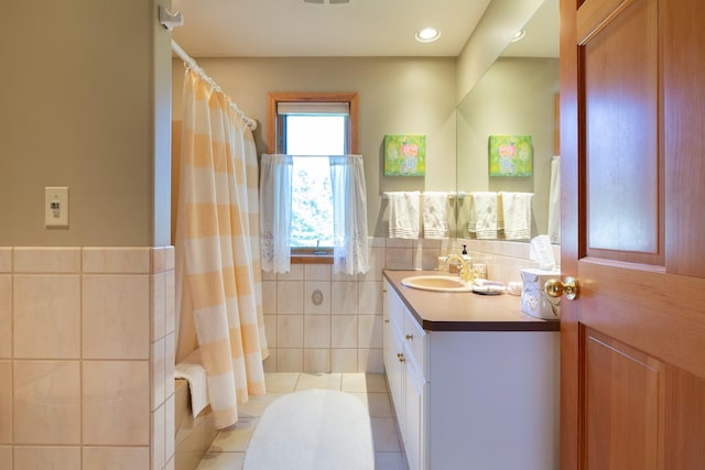 34051 Ridge Rd, Polson, MT 59860 - full bath featuring tile walls, tile patterned flooring, vanity, and curtained shower