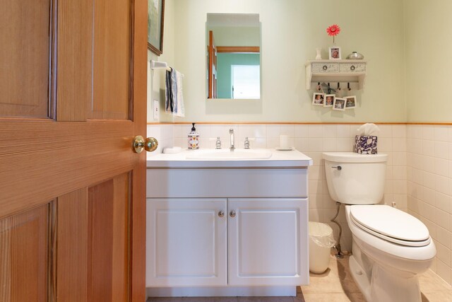 34051 Ridge Rd, Polson, MT 59860 - bathroom featuring wainscoting, toilet, and tile walls