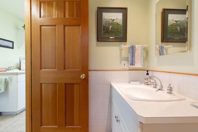 34051 Ridge Rd, Polson, MT 59860 - bathroom featuring tile walls, wainscoting, tile patterned flooring, and vanity