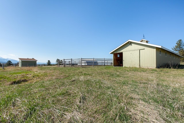 34051 Ridge Rd, Polson, MT 59860 - view of yard with fence, an outbuilding, and a pole building