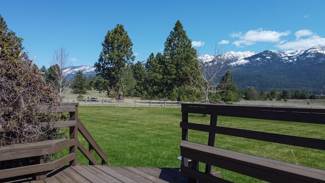 34051 Ridge Rd, Polson, MT 59860 - wooden terrace with a mountain view, a yard, a rural view, and fence