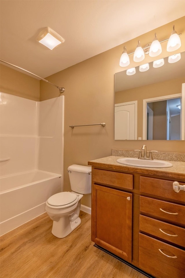 817 Vega Rd, Helena, MT 59602 - full bathroom with vanity, wood finished floors, toilet, and shower / washtub combination
