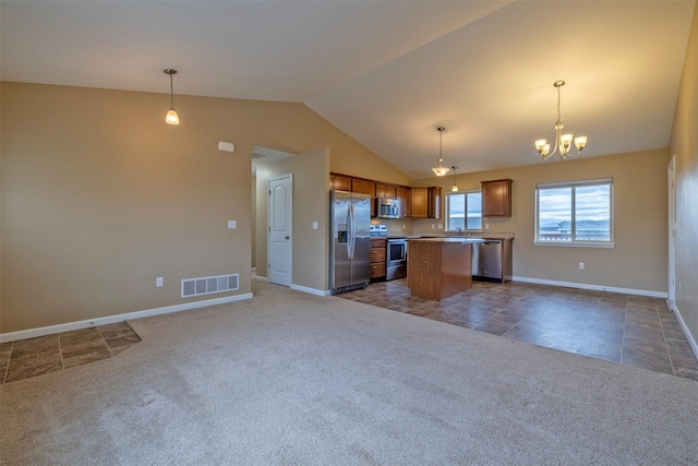 817 Vega Rd, Helena, MT 59602 - kitchen featuring appliances with stainless steel finishes, brown cabinetry, a center island, open floor plan, and visible vents