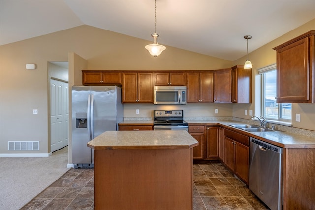 817 Vega Rd, Helena, MT 59602 - kitchen featuring visible vents, lofted ceiling, a kitchen island, a sink, and appliances with stainless steel finishes