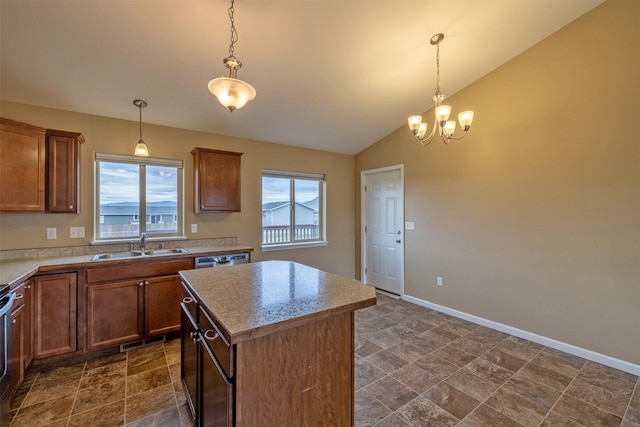 817 Vega Rd, Helena, MT 59602 - kitchen featuring a notable chandelier, a sink, visible vents, a center island, and vaulted ceiling