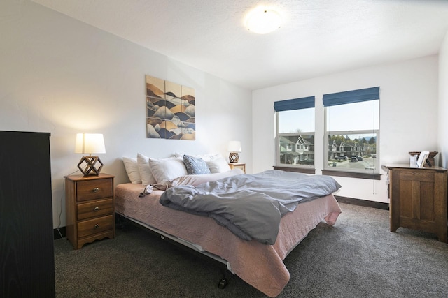 carpeted bedroom with baseboards