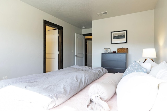 bedroom with visible vents