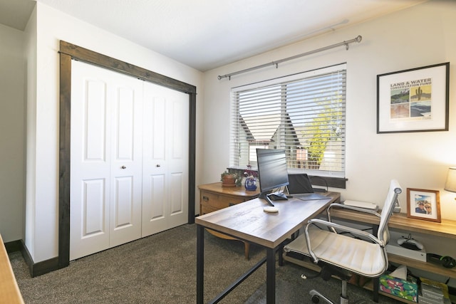 home office featuring dark colored carpet