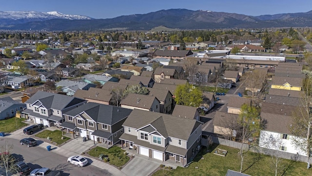 drone / aerial view featuring a residential view and a mountain view