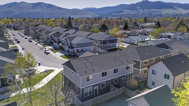drone / aerial view with a residential view and a mountain view