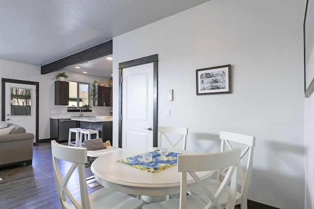 dining area with dark wood finished floors