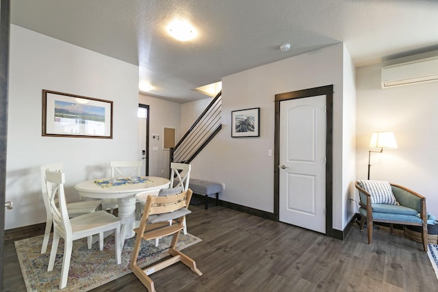 dining space with stairway, baseboards, an AC wall unit, and dark wood-style floors
