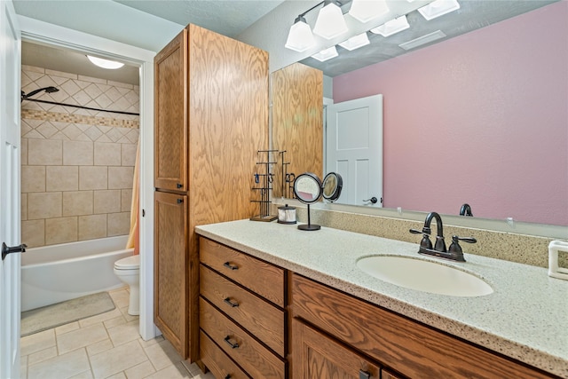bathroom featuring a skylight, tile patterned flooring, vanity, toilet, and tub / shower combination