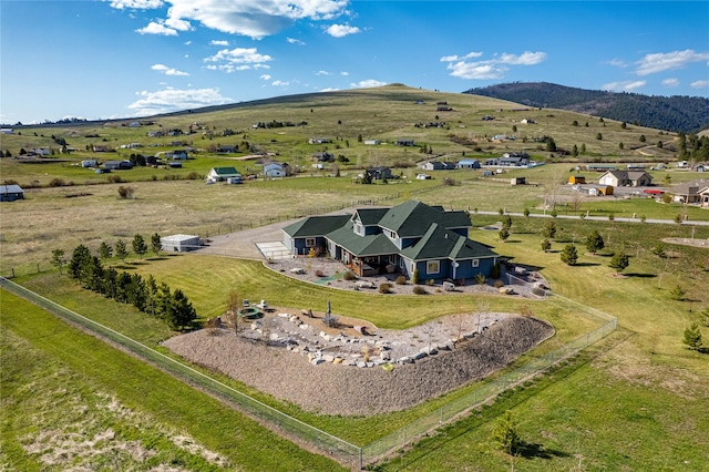 aerial view with a mountain view and a rural view