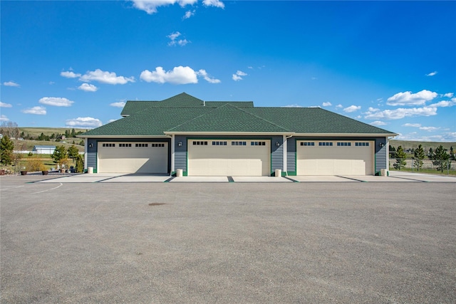 view of front of home featuring roof with shingles