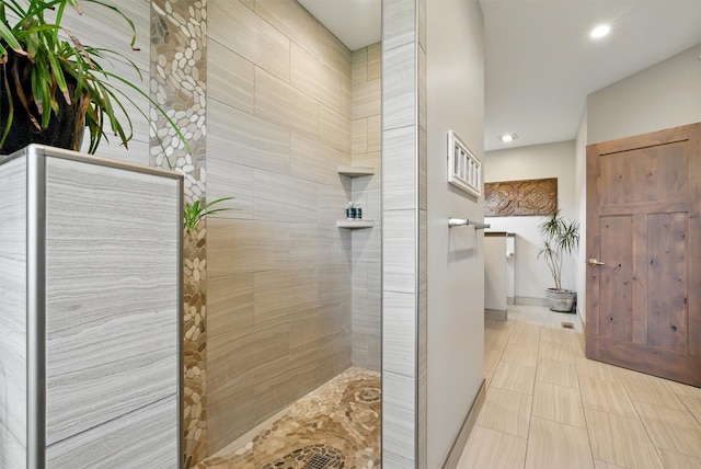 bathroom featuring recessed lighting, a walk in shower, and tile patterned flooring