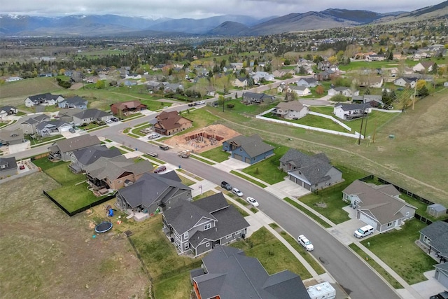 drone / aerial view featuring a residential view and a mountain view