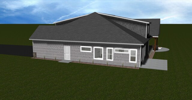 1066 Lake Pointe Dr, Bigfork, MT 59911 - view of home's exterior with a yard and a shingled roof