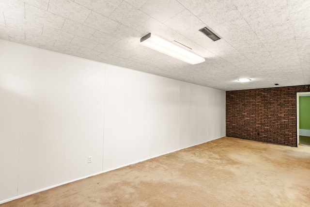 416 Riverview Dr E, Great Falls, MT 59404 - finished basement with visible vents, carpet floors, and brick wall