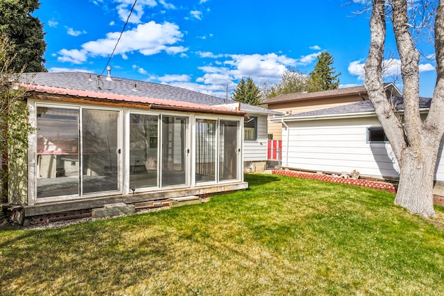 416 Riverview Dr E, Great Falls, MT 59404 - back of property featuring a yard and a sunroom