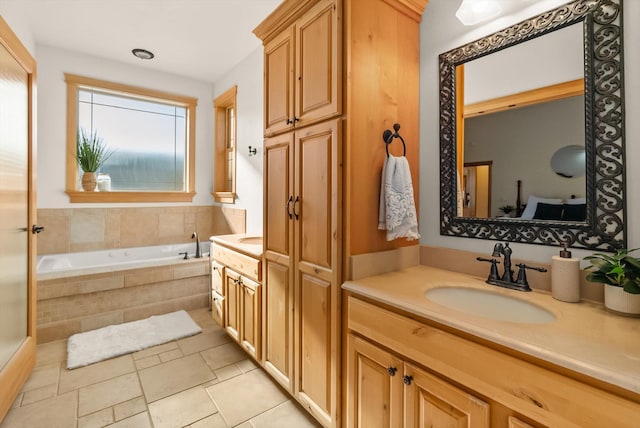 bathroom with vanity and a bath