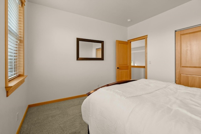 carpeted bedroom with baseboards
