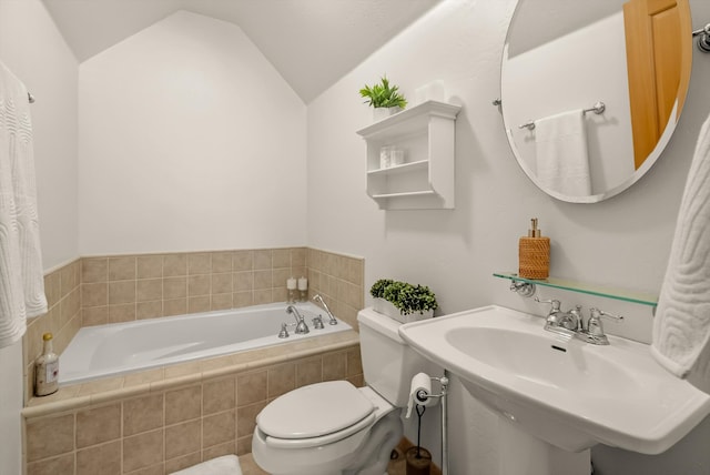 bathroom with vaulted ceiling, a garden tub, toilet, and a sink