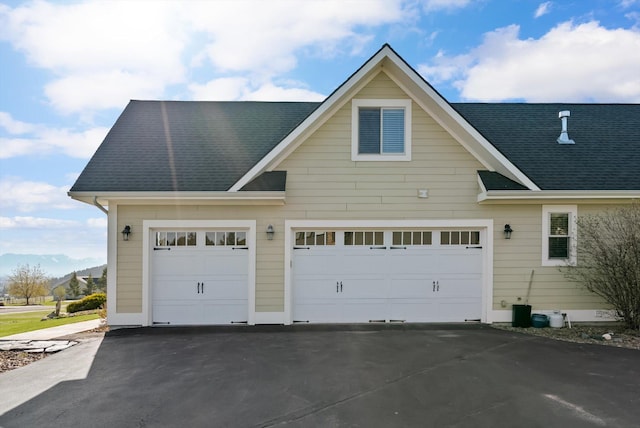 garage featuring aphalt driveway