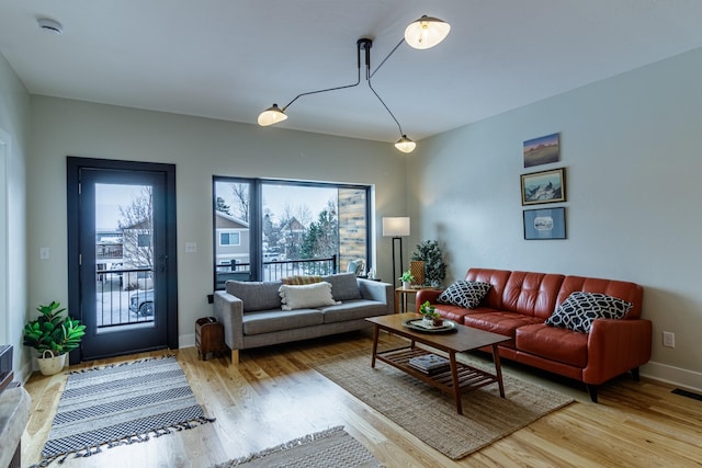 2216 S 12th St W, Missoula, MT 59801 - living room featuring light wood-type flooring and baseboards