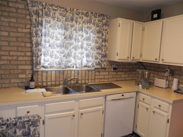 kitchen with white cabinets, light countertops, a sink, and dishwasher