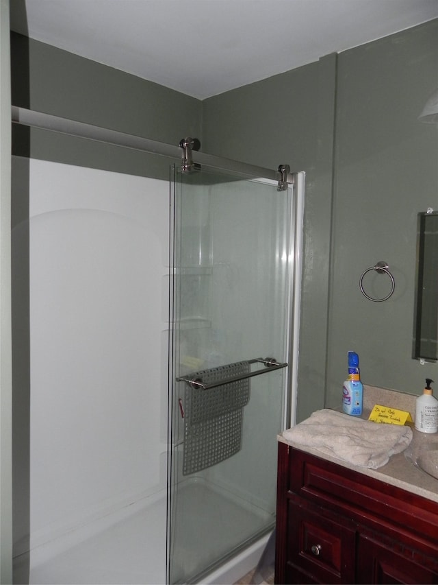 full bath featuring a shower stall and vanity