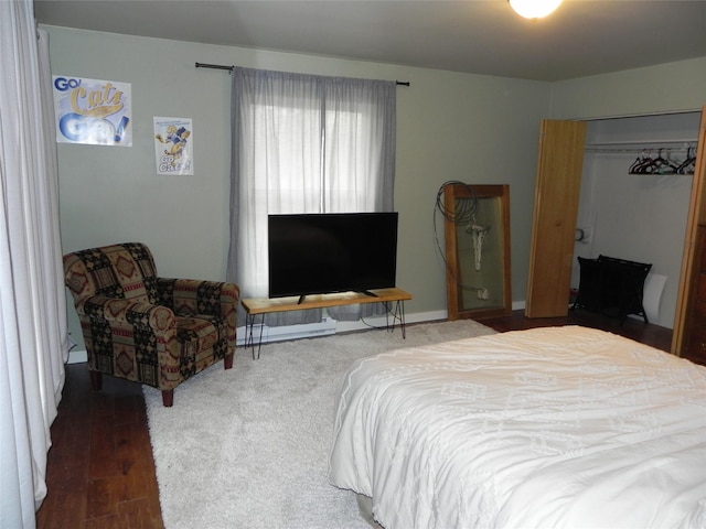 bedroom with wood finished floors
