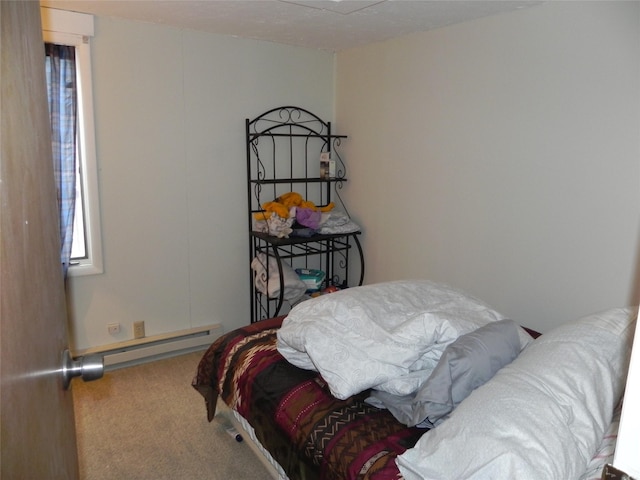 carpeted bedroom with baseboard heating