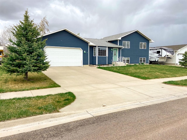 329 35th Ave NE, Great Falls, MT 59404 - tri-level home featuring a garage, driveway, a front yard, and roof with shingles
