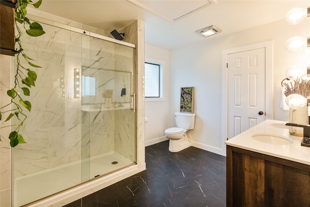 full bathroom featuring toilet, baseboards, a sink, and a marble finish shower