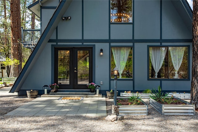 view of exterior entry featuring french doors
